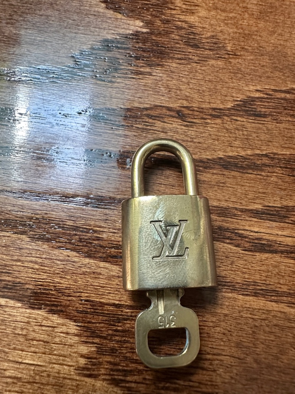 Louis Vuitton Gold Padlock with LV Monogram